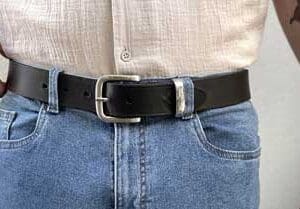 man in jeans with black leather belt